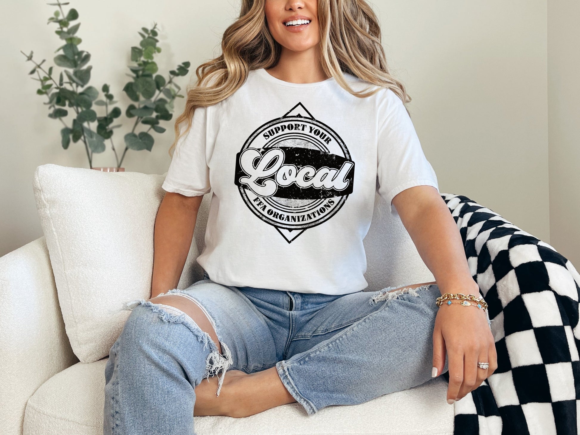 a woman sitting on top of a white couch